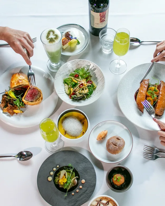 Overhead view of a plated table at LOHERB Cuisine
